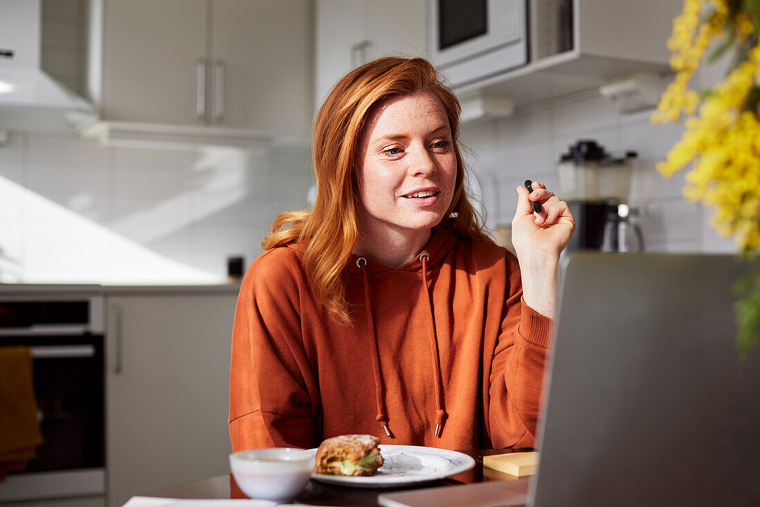 Woman using laptop at home