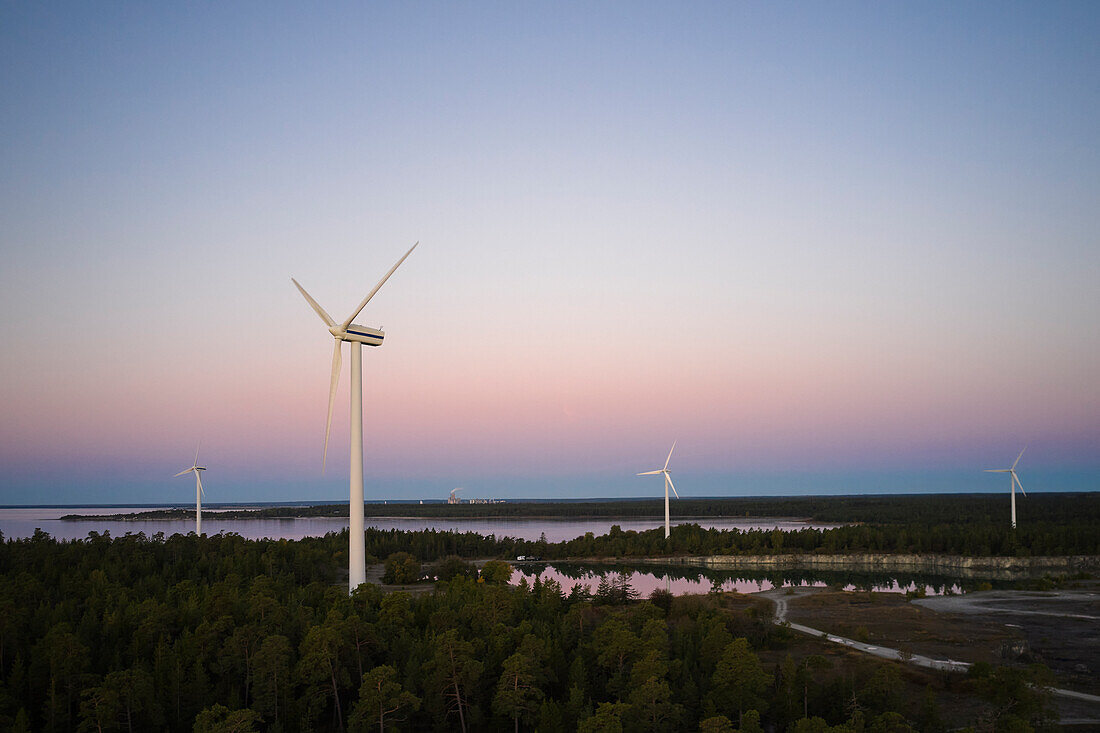 Wind turbines against sky