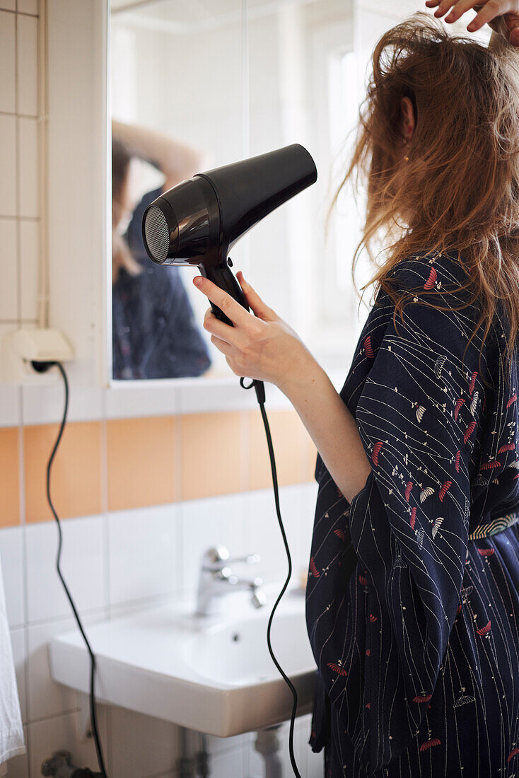 Woman drying hair