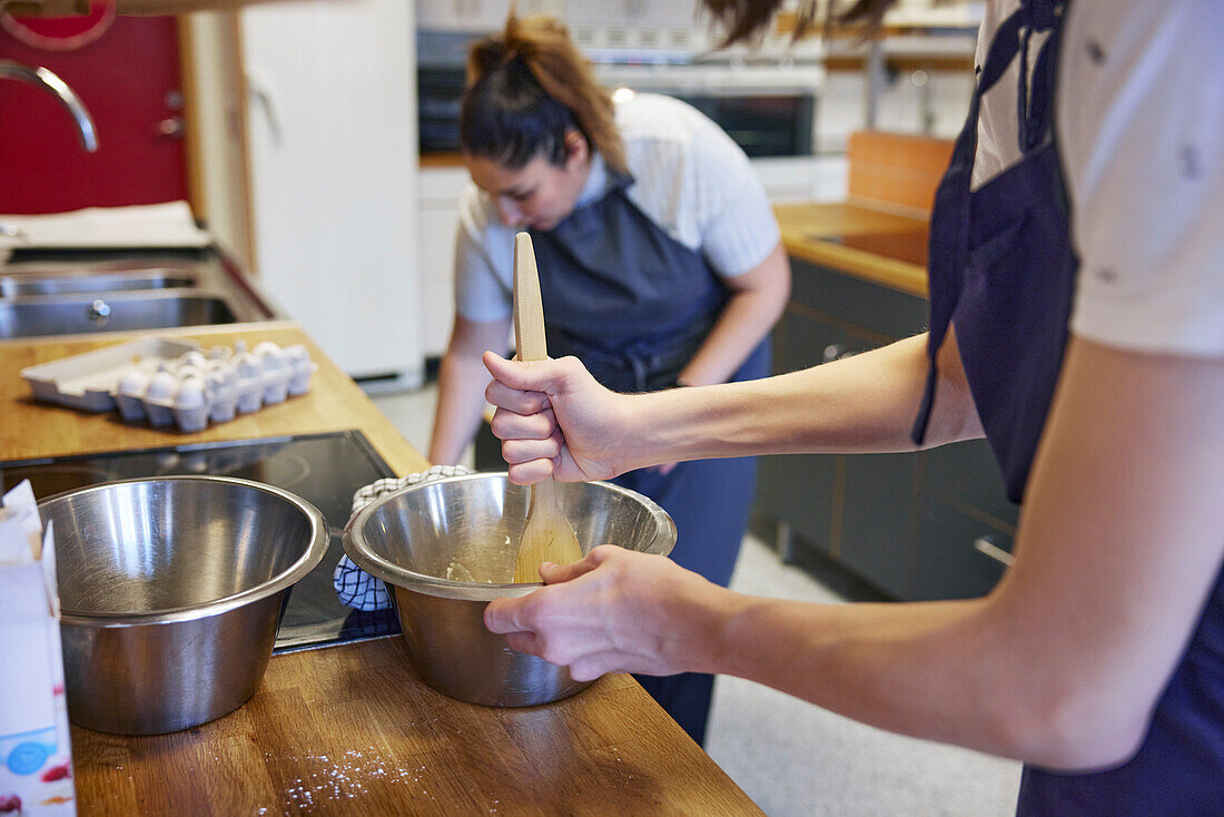 Women in kitchen preparing food