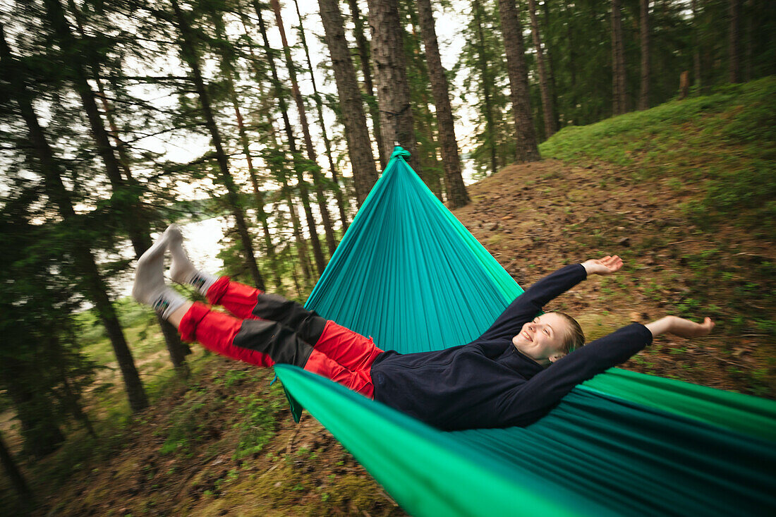 Woman relaxing on hammock