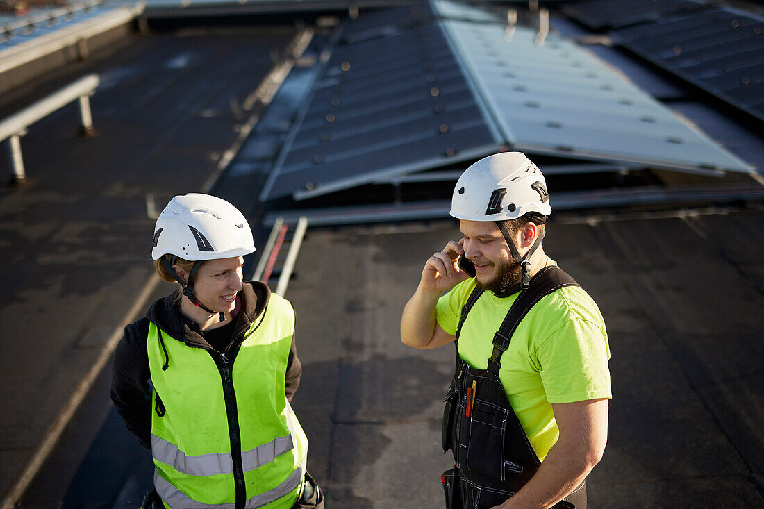 Workers standing on roof