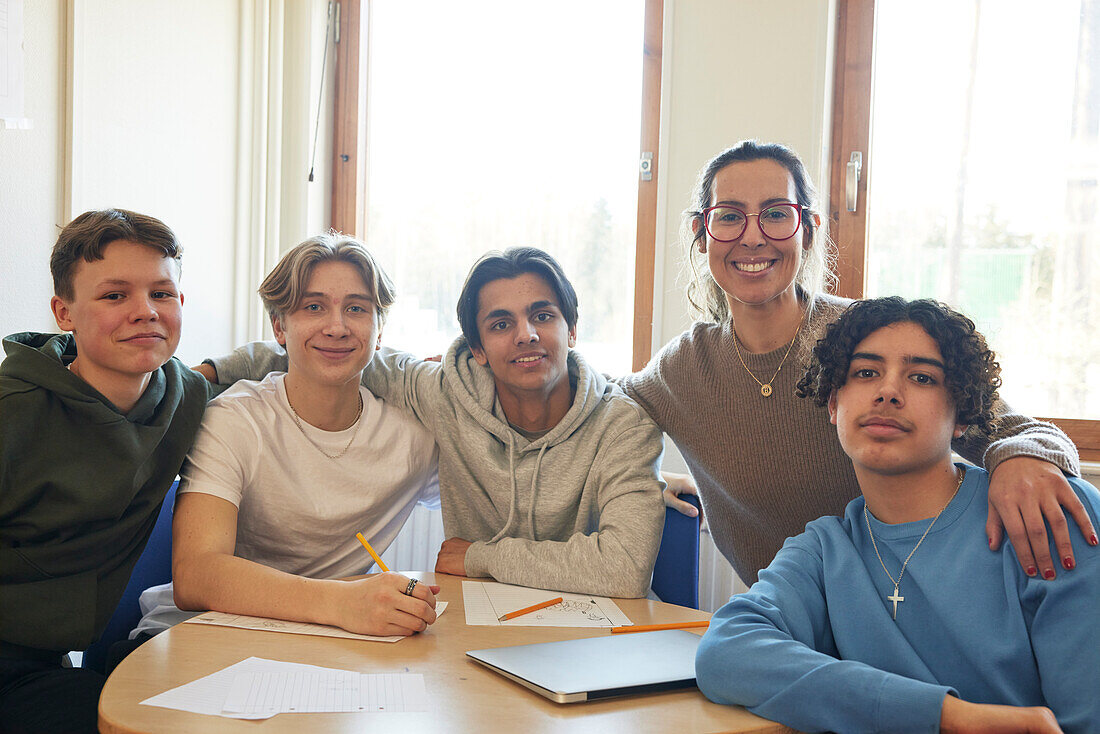 Teenage friends looking at camera