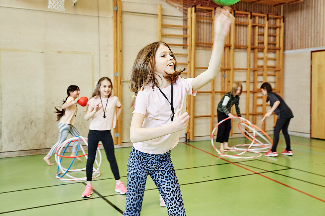 Children having PE class in school gym