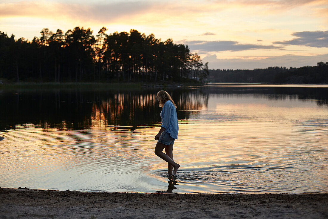 Woman walking at lake