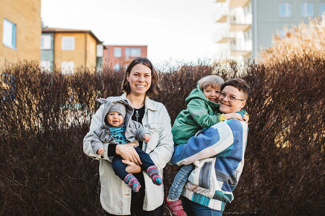 Women with children looking at camera