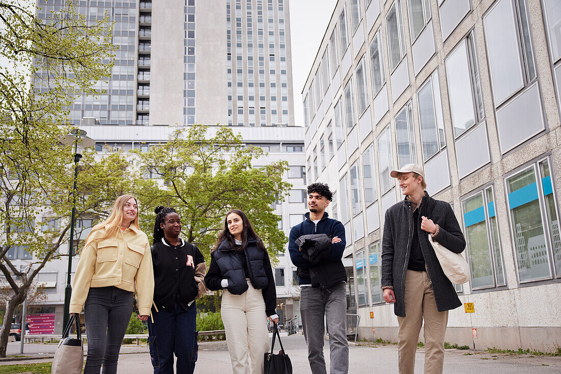 Group of friends walking on street