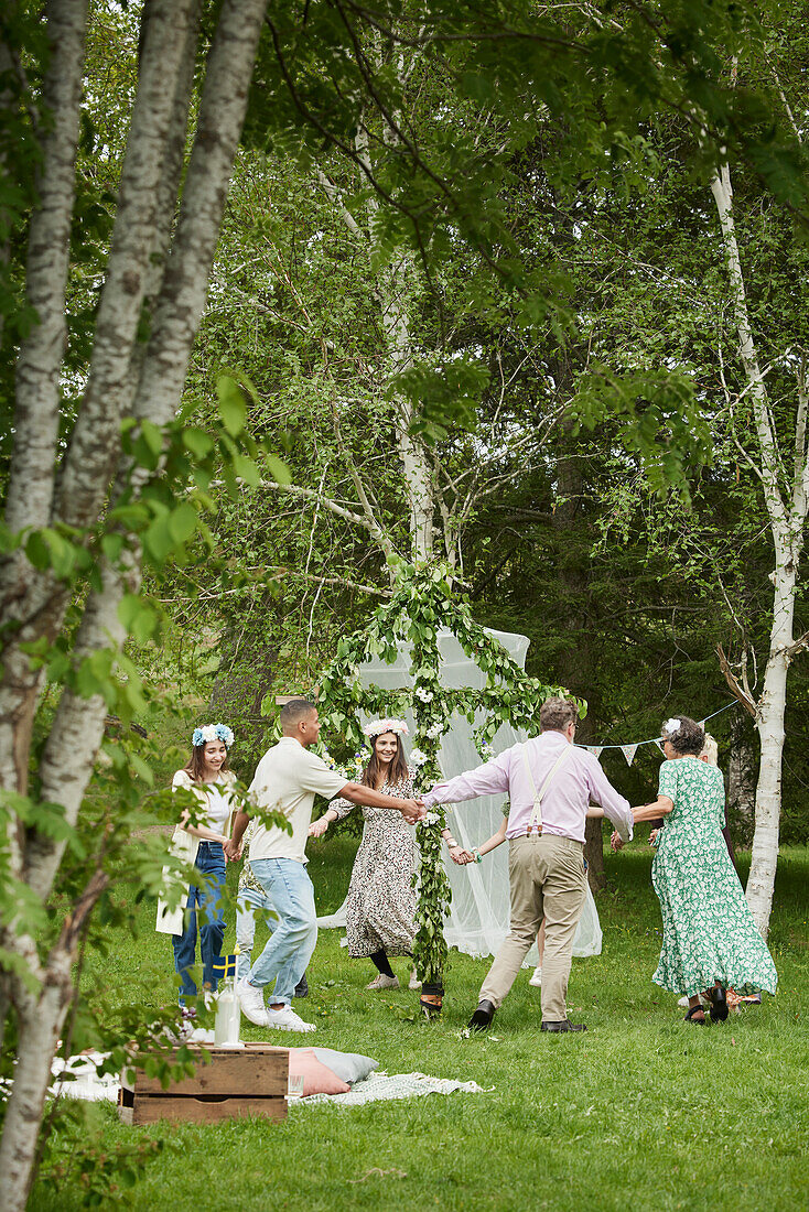 People dancing around maypole