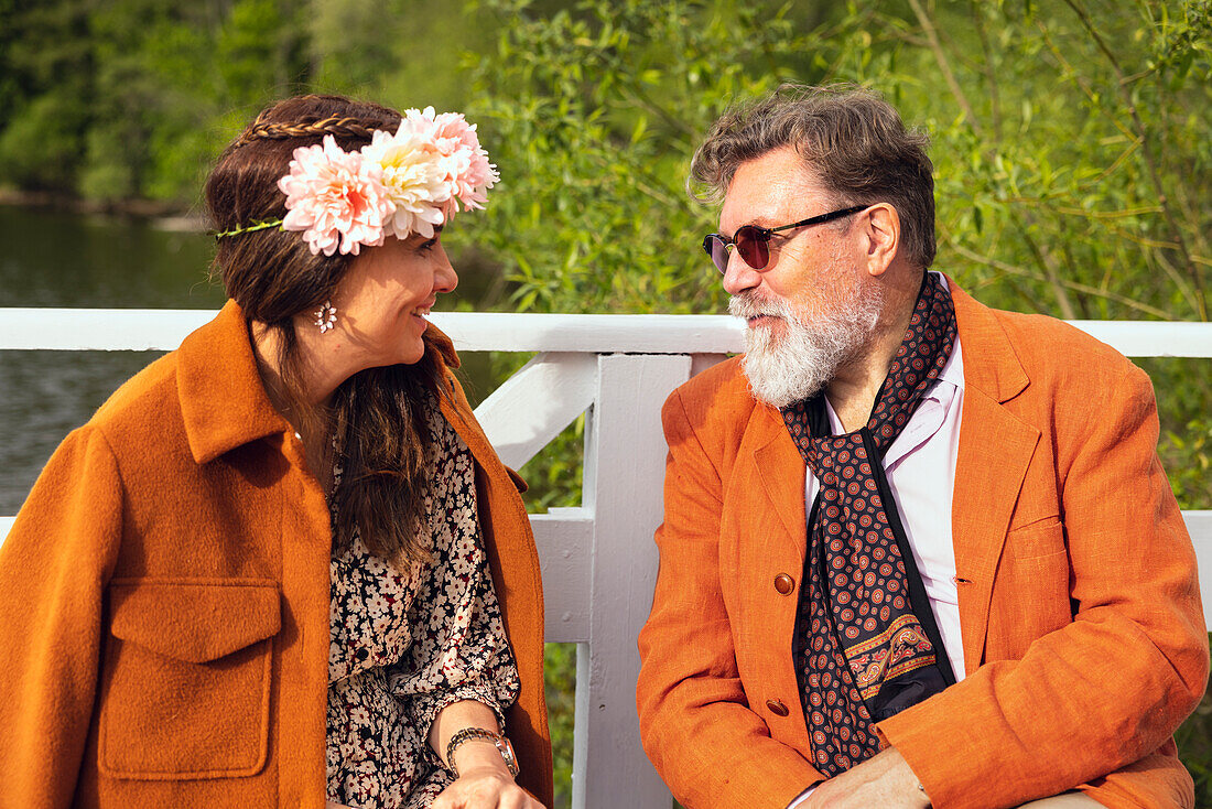 Man and woman talking outdoors