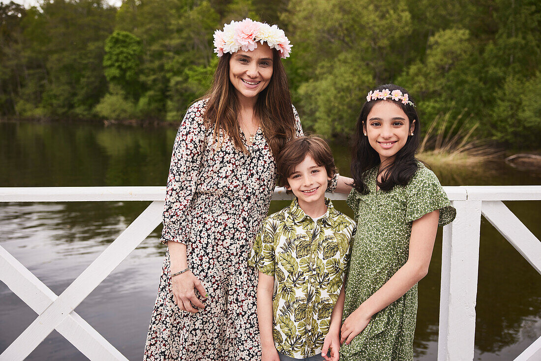 Mother with children standing at lake