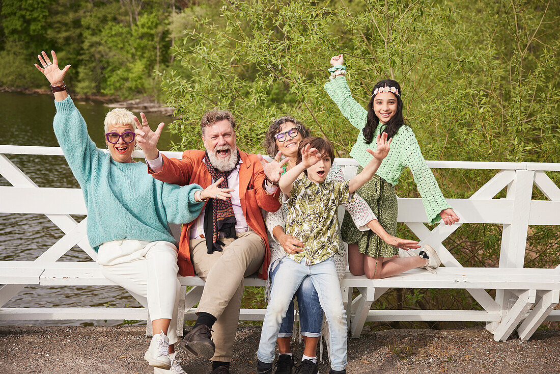 Grandparents with grandchildren on bench