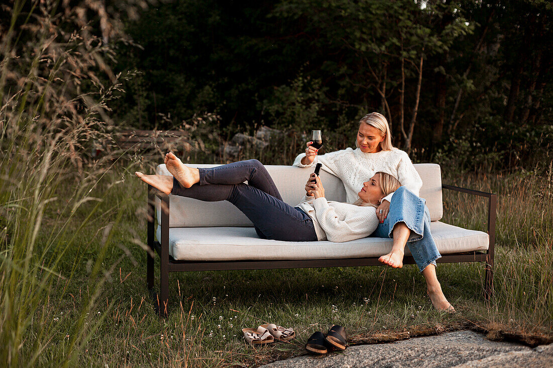 Female friends sitting on bench