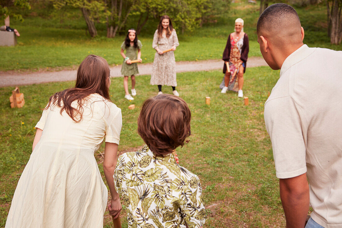 People playing molkky outdoors