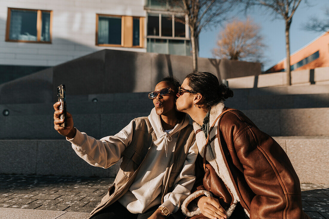 Female friends taking selfie