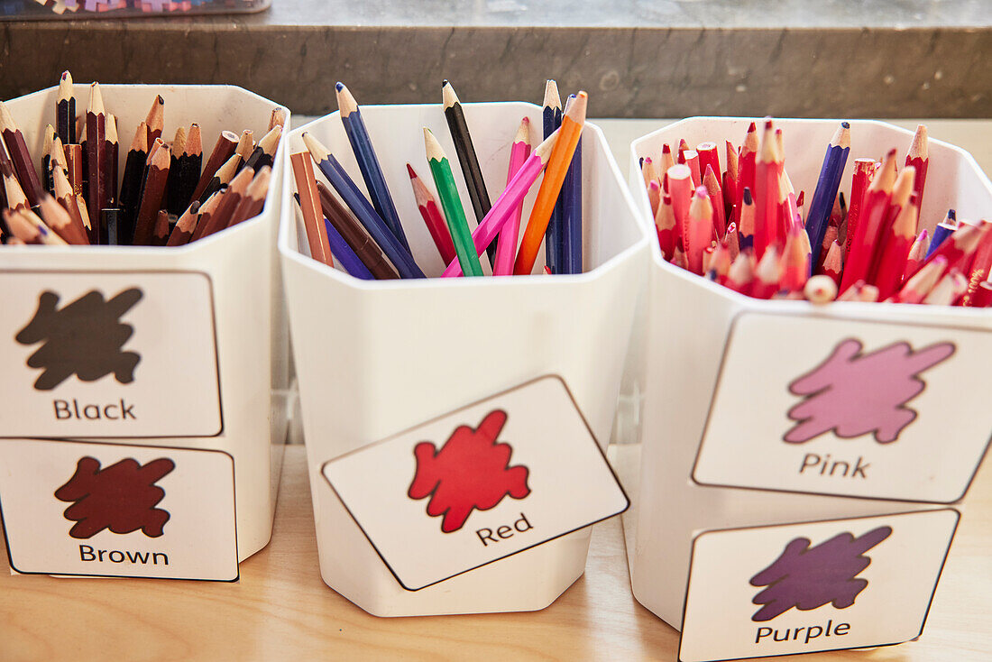 Crayons in plastic containers