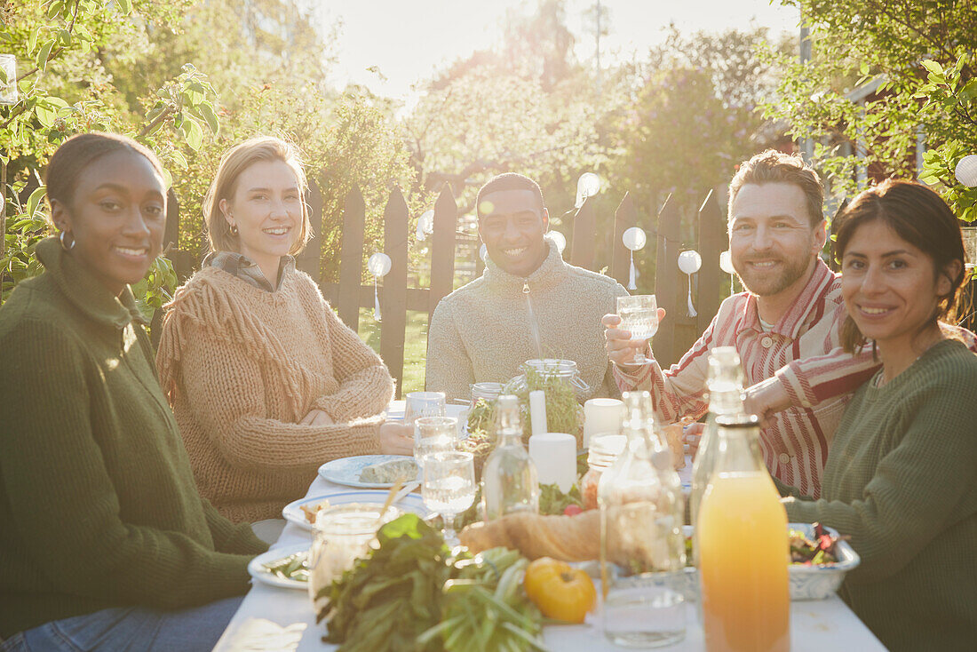 Friends having meal in garden