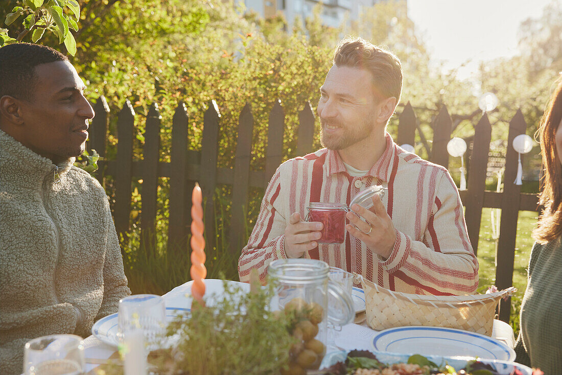 Friends having meal in garden