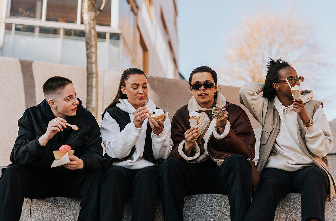 Young friends eating ice-creams