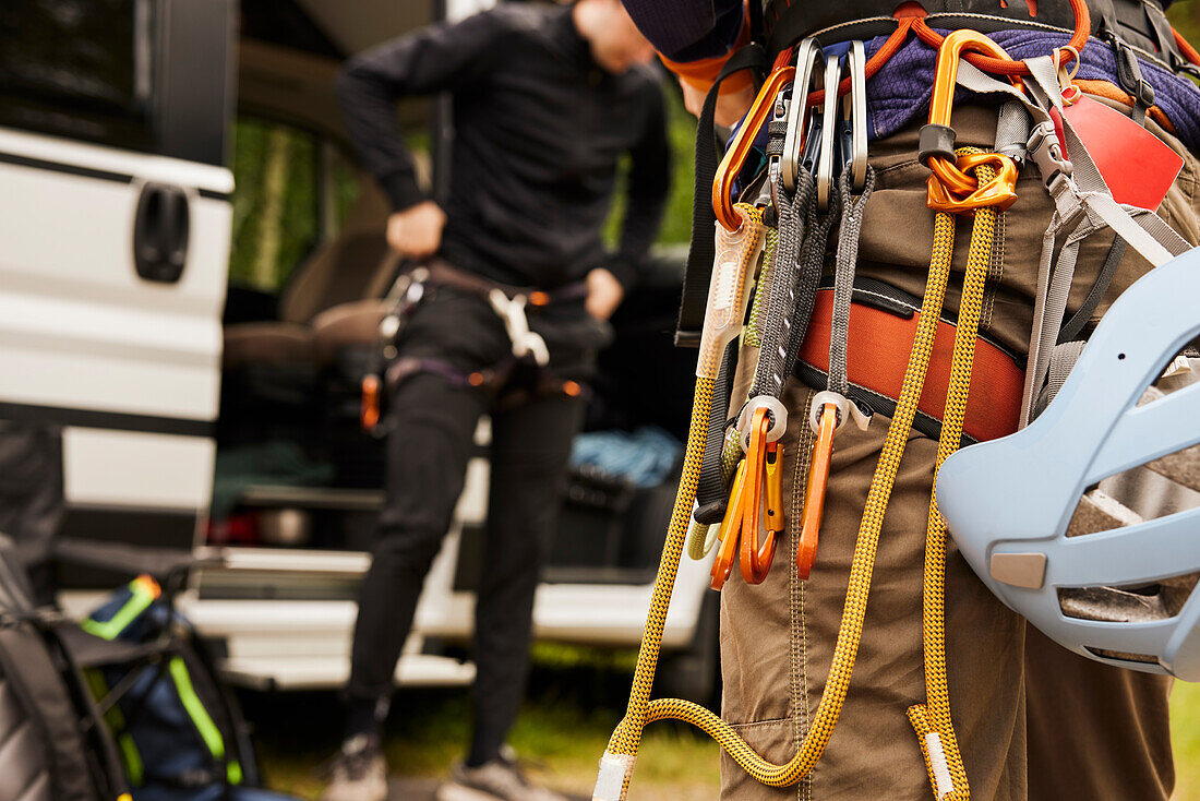 Rock climbers putting gear on