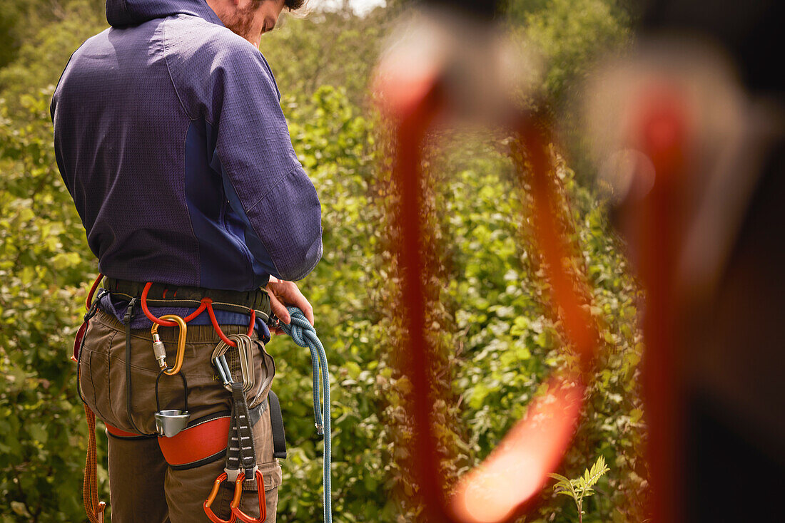 Male rock climber getting ready