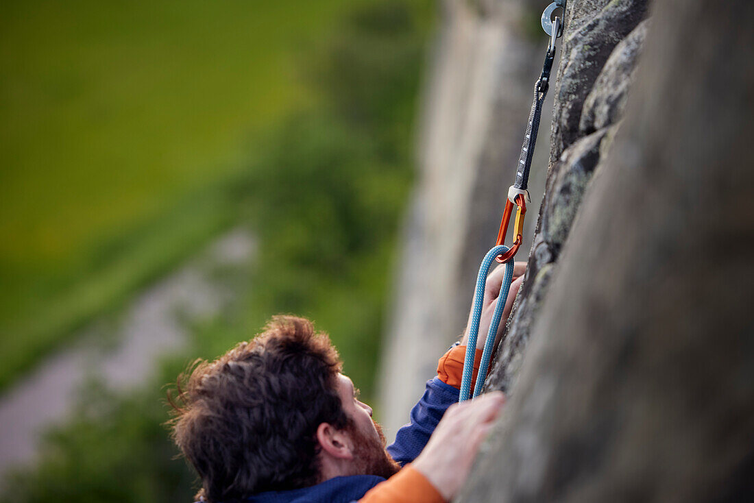 Close-up of man rock climbing