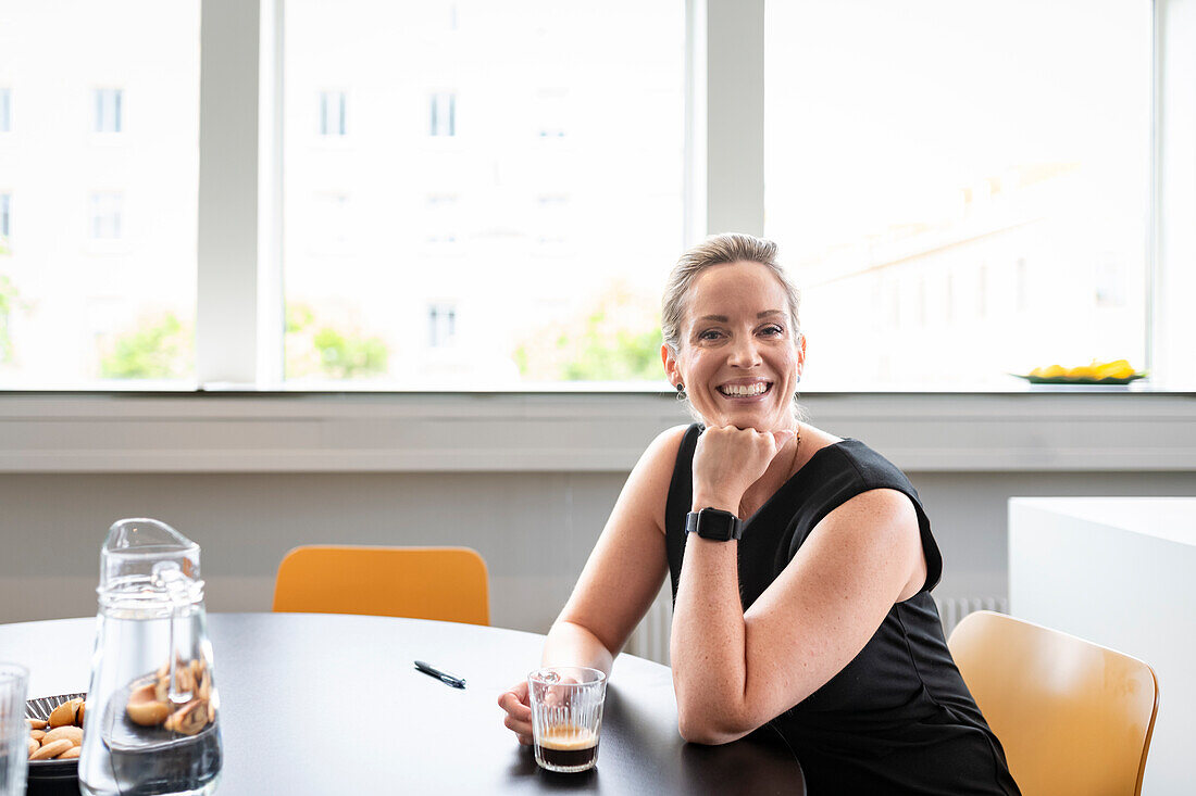 Businesswoman sitting in boardroom