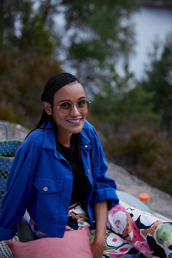 Portrait of smiling woman relaxing in nature