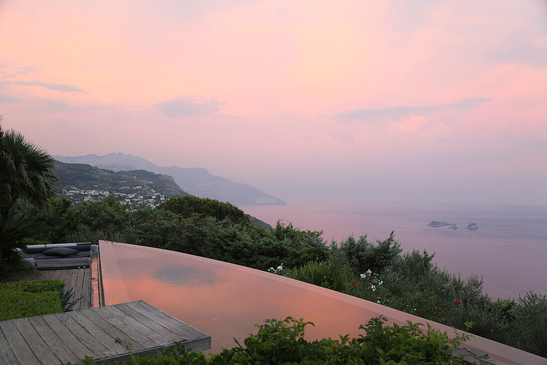 Evening sky reflecting in infinity pool