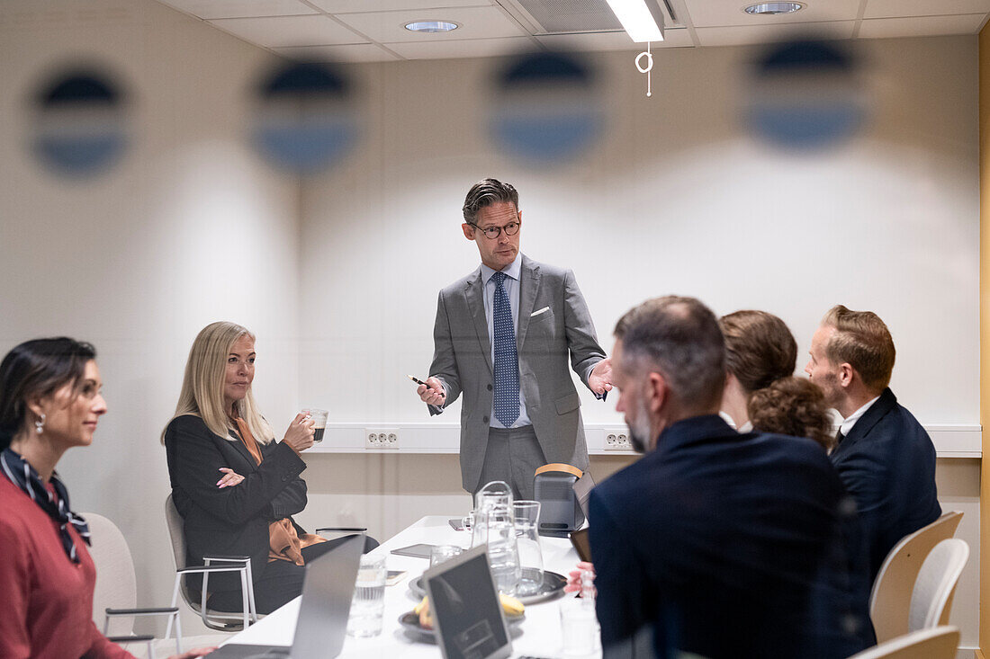 Business people having meeting in boardroom