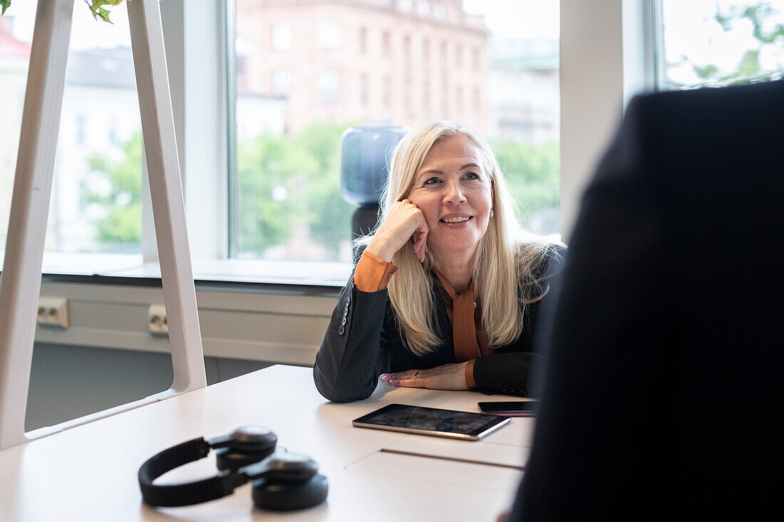 Smiling businesswoman in office