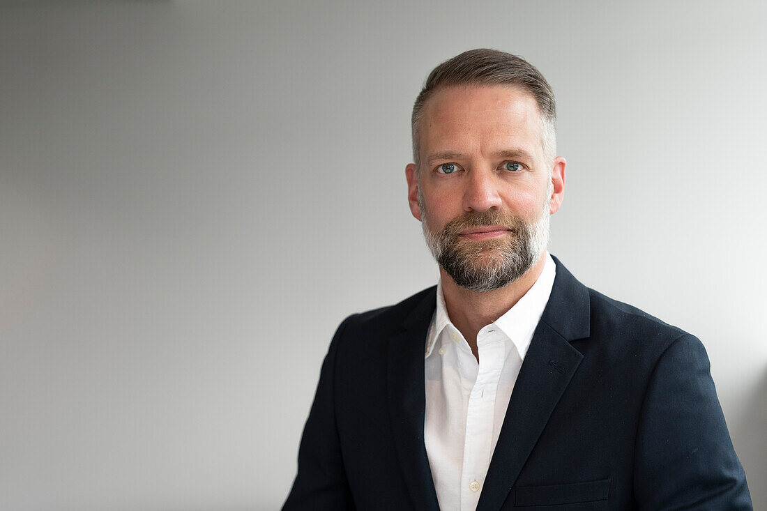 Portrait of businessman looking at camera