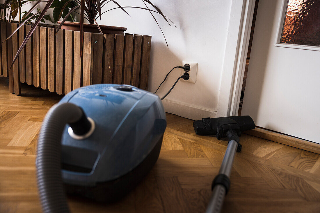 Vacuum cleaner plugged in wall outlet