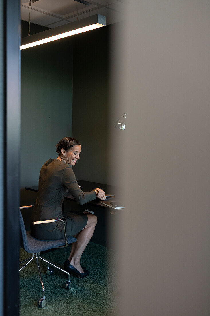 Businesswoman sitting in conference room