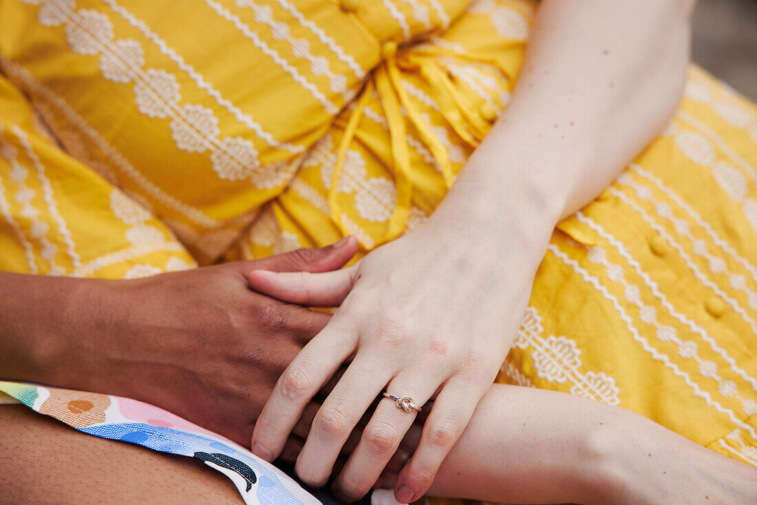 Female couple holding hands