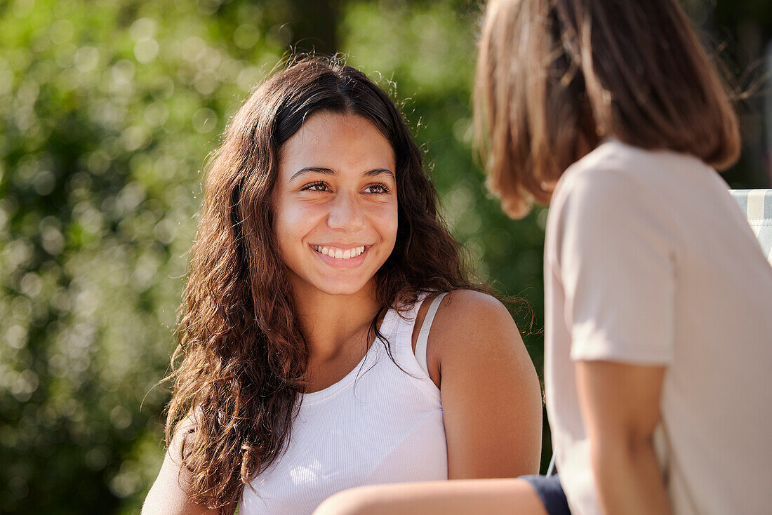 Smiling teenage girl looking away