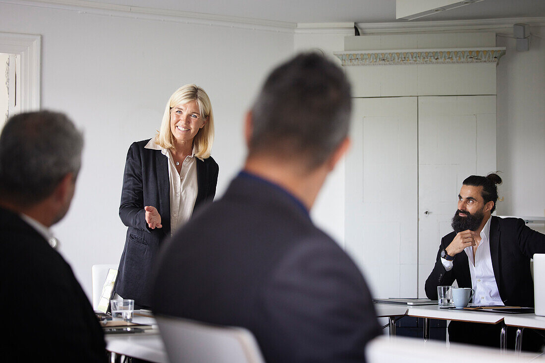 Smiling businesswoman at meeting