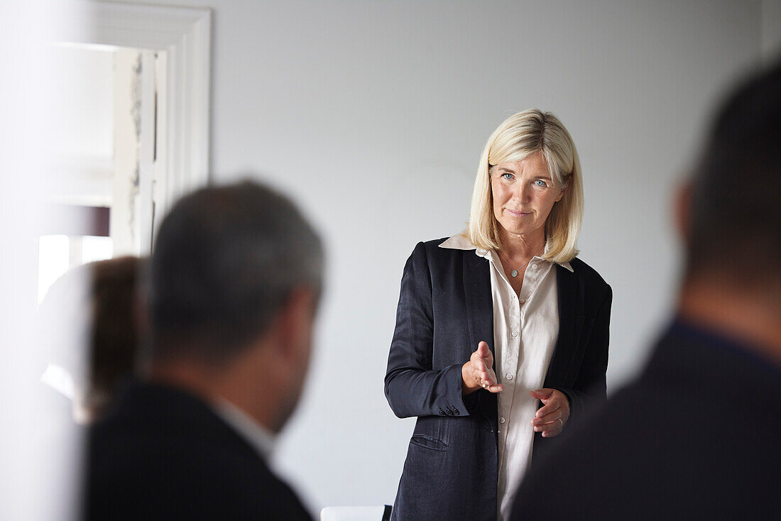 Smiling businesswoman at meeting