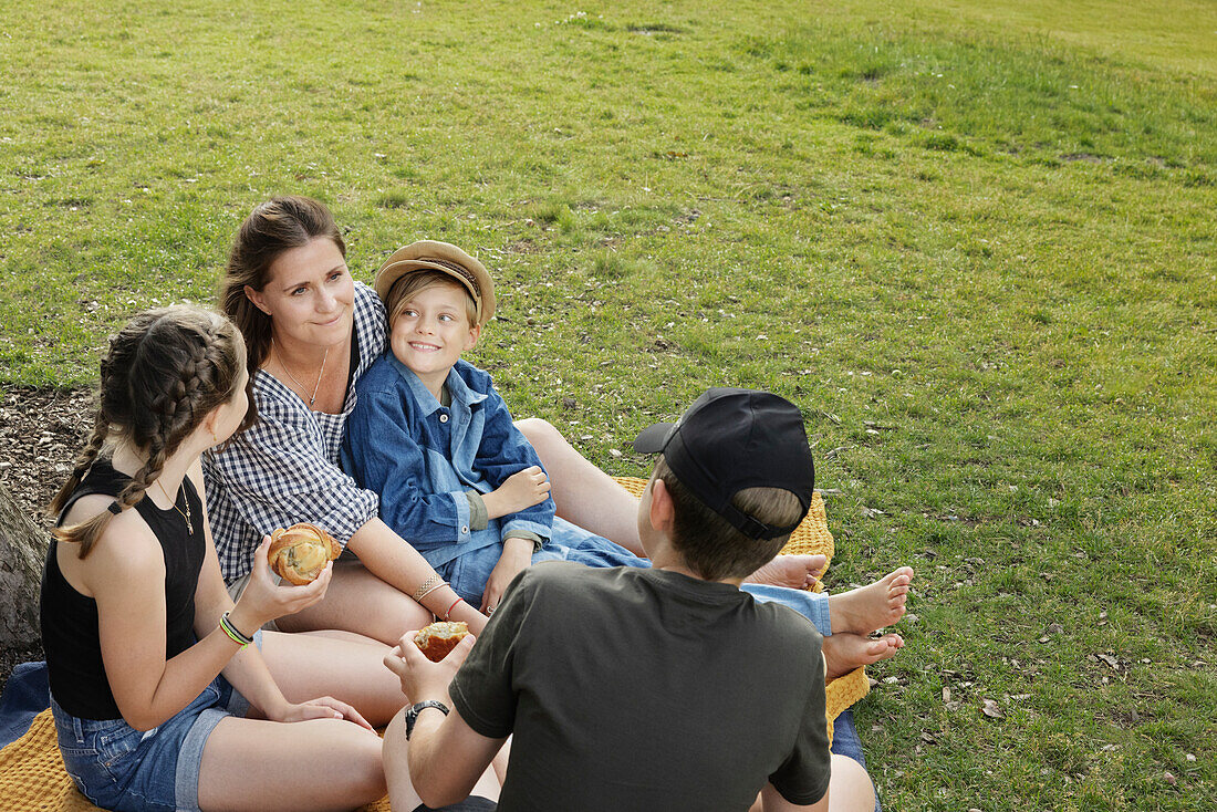 Mother having picnic with children