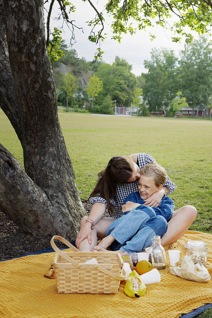 Mother and daughter having picnic