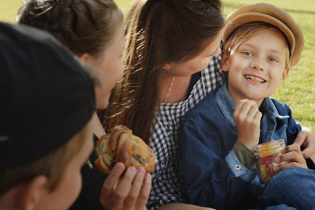 Mother having picnic with children