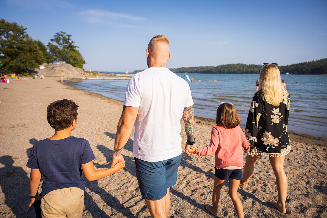 Family walking together at beach