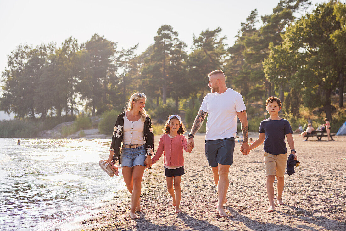 Family walking together at beach