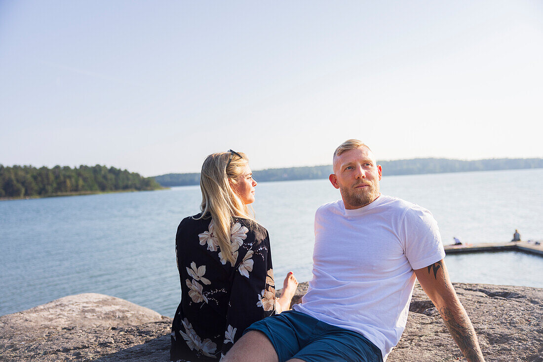 Couple relaxing at sea