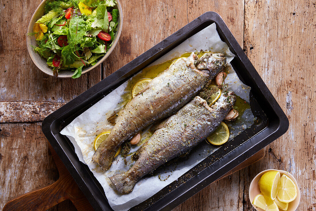 Trout from the oven served with salad