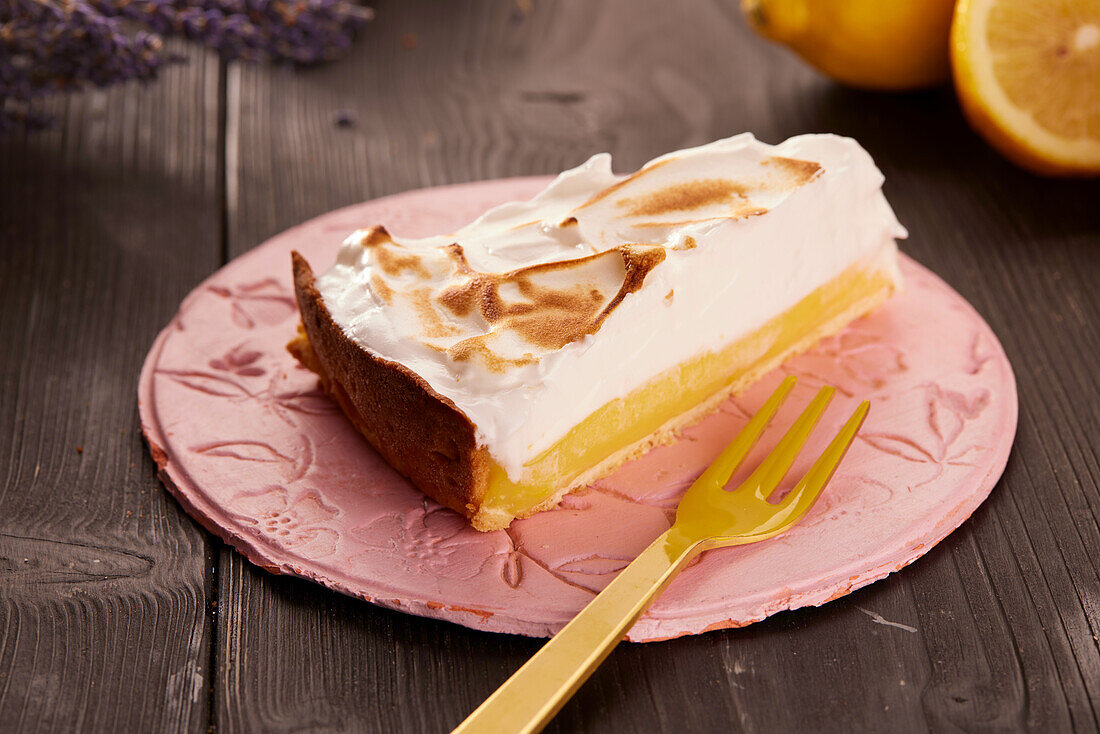 A piece of Lemon Pie with meringue on a plate