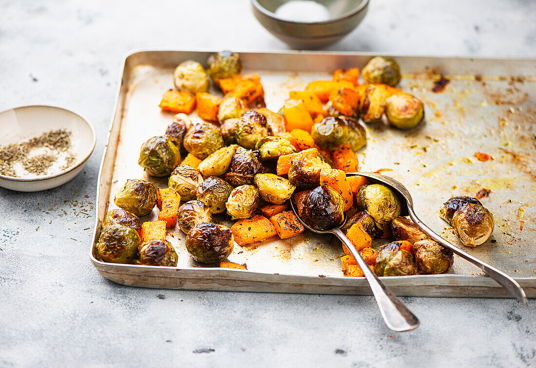 Roasted brussels sprouts and pumpkin on sheet pan