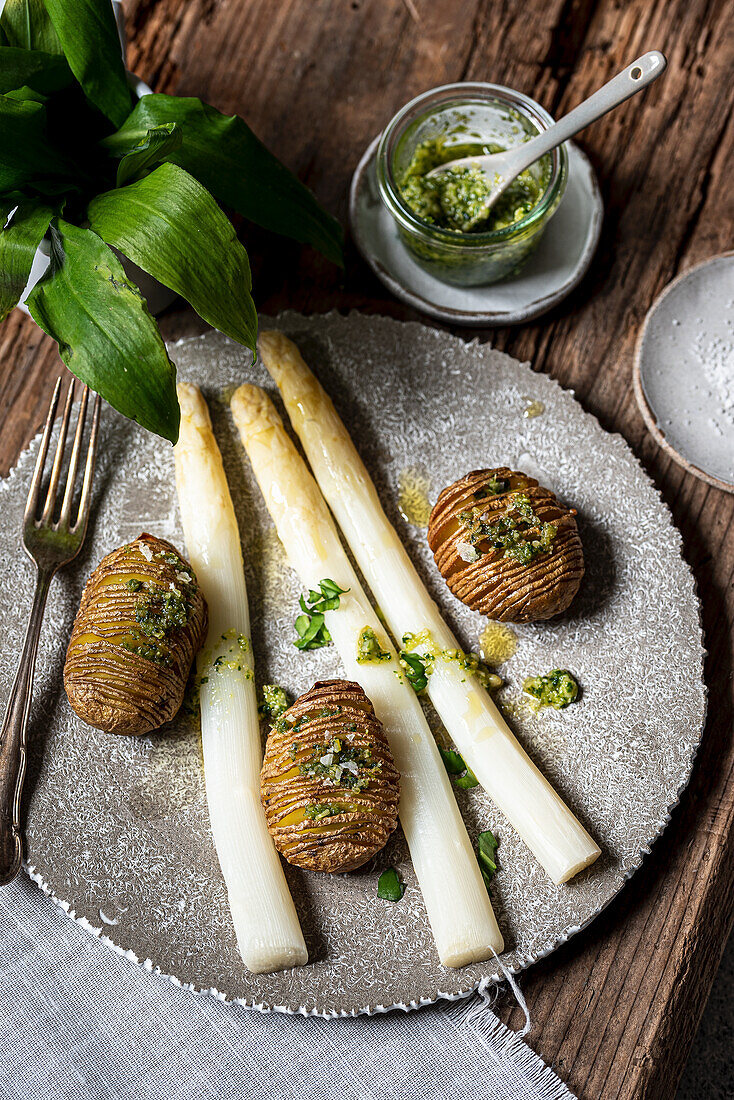 Hasselback potatoes with wild garlic pesto and asparagus