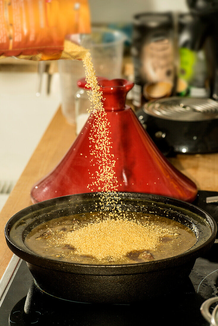 Preparing a tajine with lamb and couscous