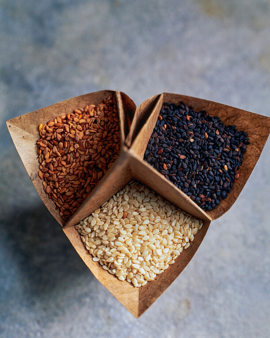 Three kinds of sesame seeds in origami paper bowls