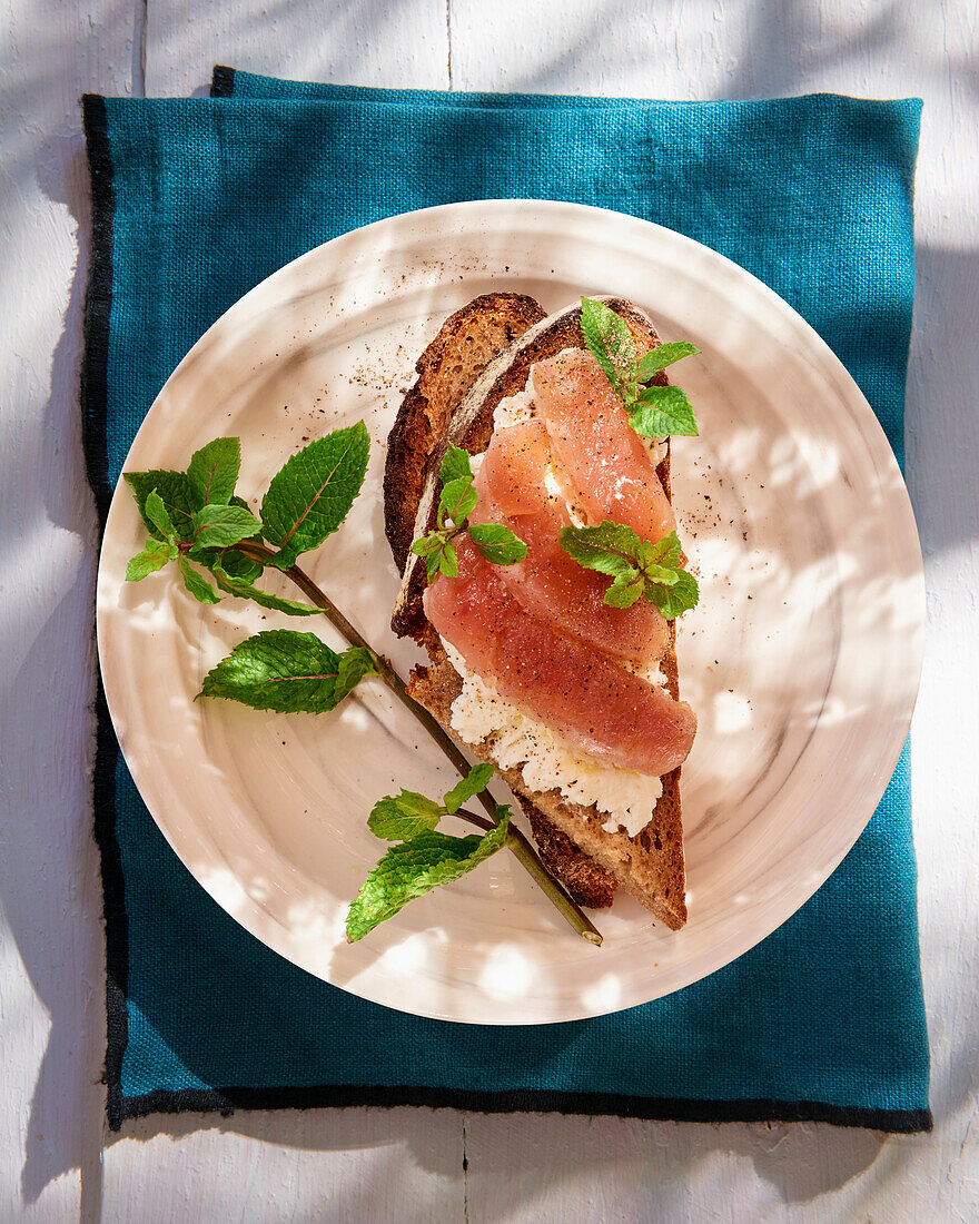 Bread topped with ricotta and tuna